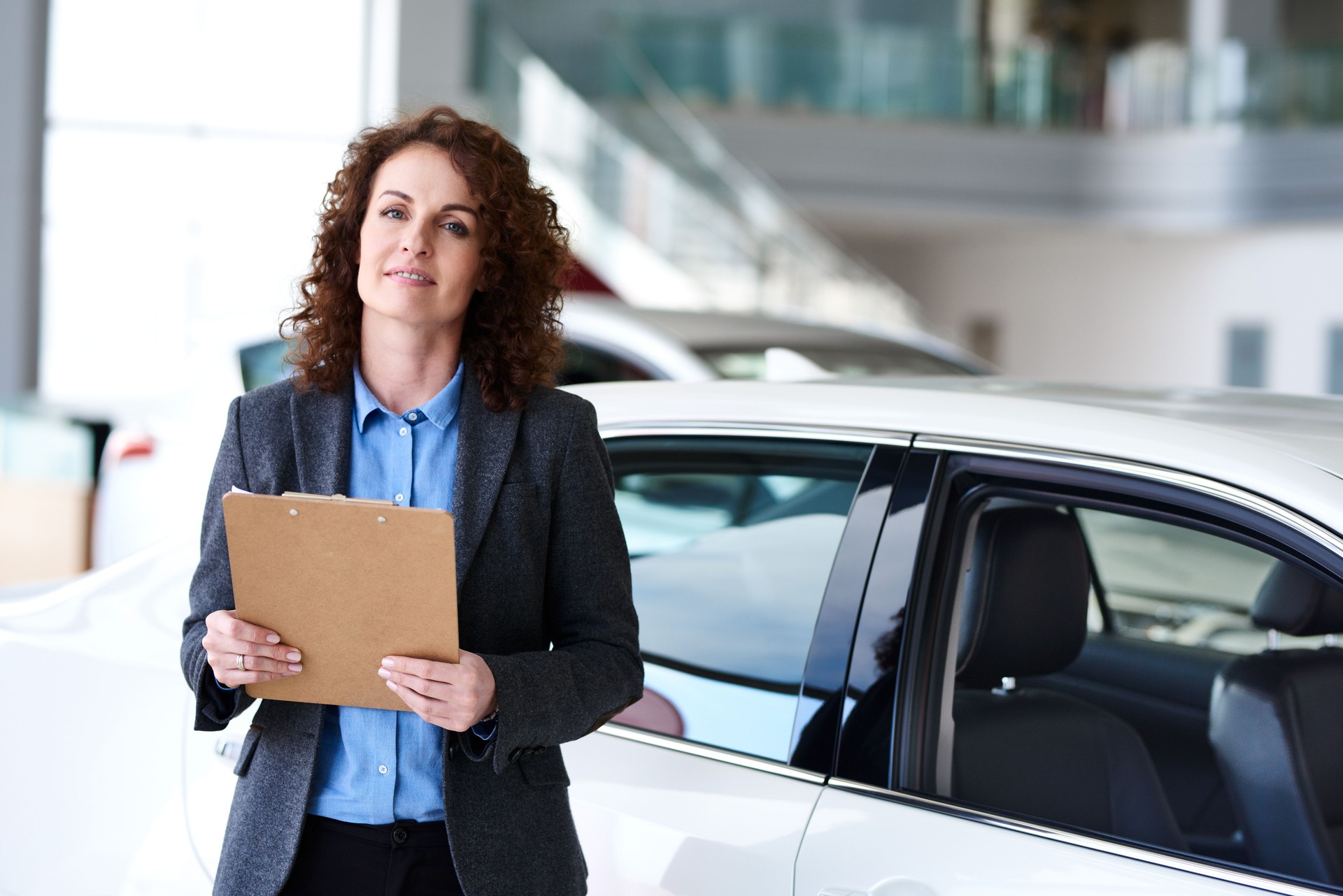 Woman as auto dealership worker