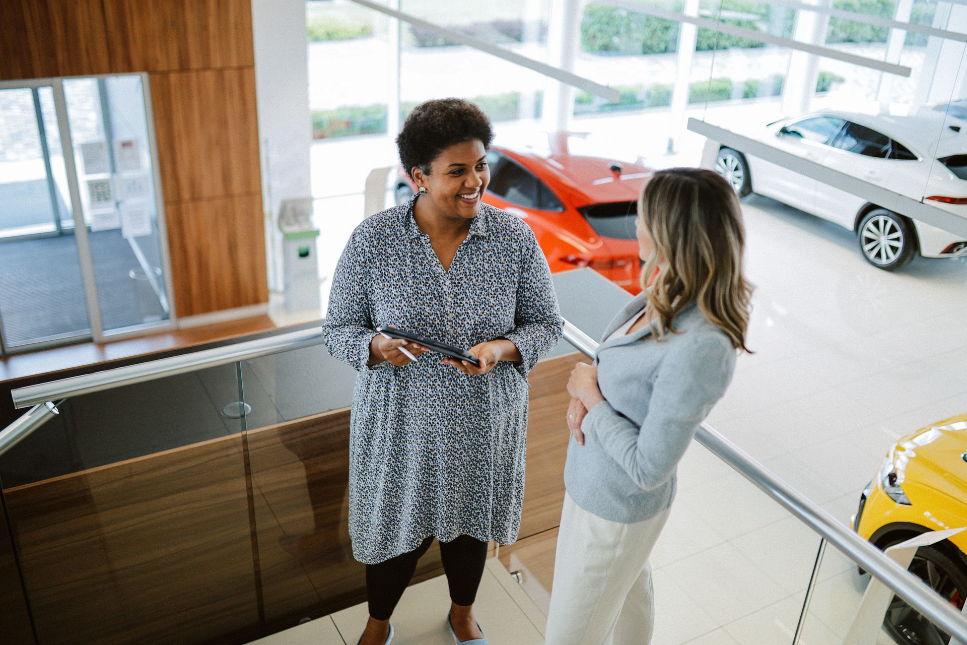 customer and a salesperson in the car showroom